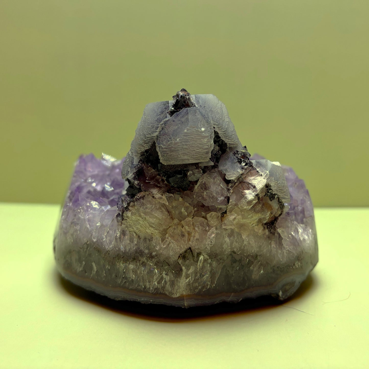 Light Purple Amethyst Geode (Agate Banded) with Layered Calcite on Hematite | Uruguay  | 922 g | 95 x 100 x 65 mm.